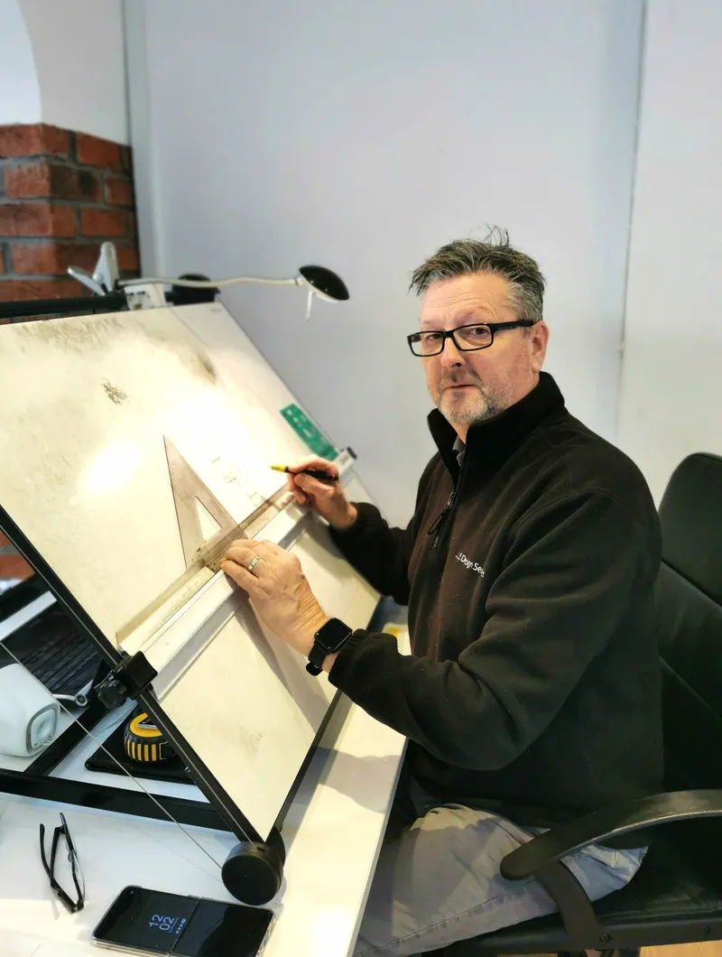 Ken Coleman at his drawing board